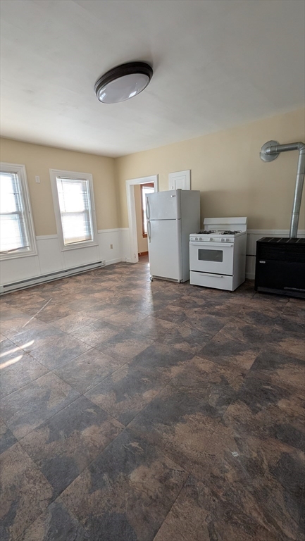 6 Brandon Road, Unit 2 Dudley, MA 01571 - Photo 2 of 9 a view of an empty room with a window