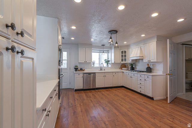 1045 Fox Farm Road Logan, UT 84321 - Photo 20 of 65 Kitchen featuring a textured ceiling, recessed lighting, hanging light fixtures, dark wood-type flooring, and stainless steel appliances