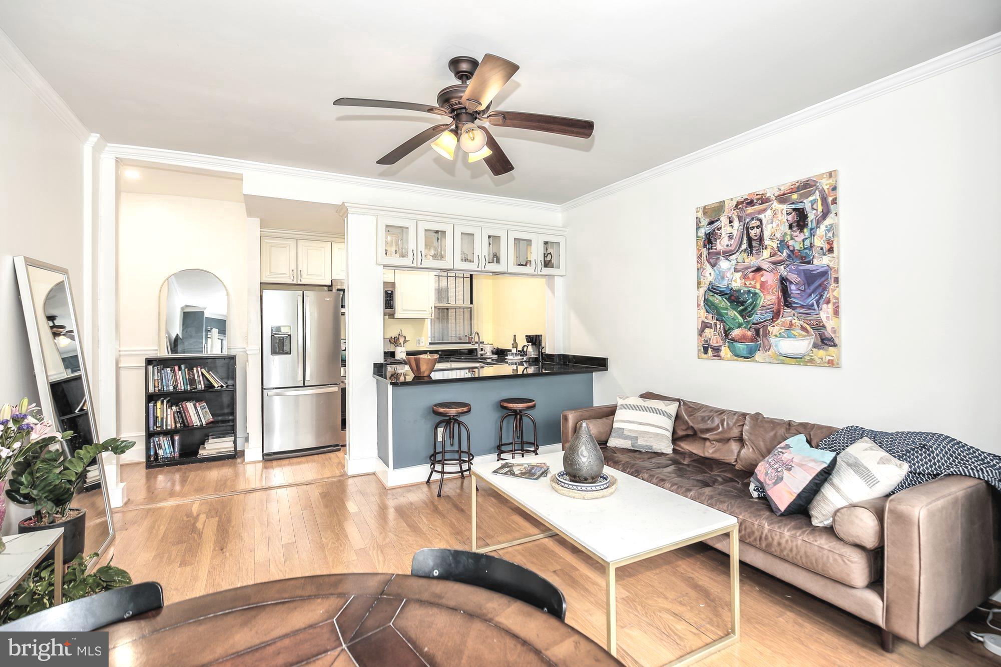 1820 Clydesdale Place Northwest, Unit 103 Washington, DC 20009 - Photo 7 of 14 a living room with furniture and a wooden floor