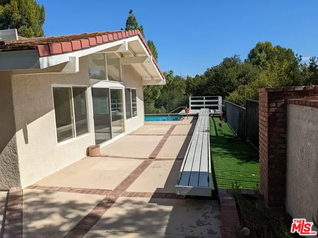 a view of a backyard with pool