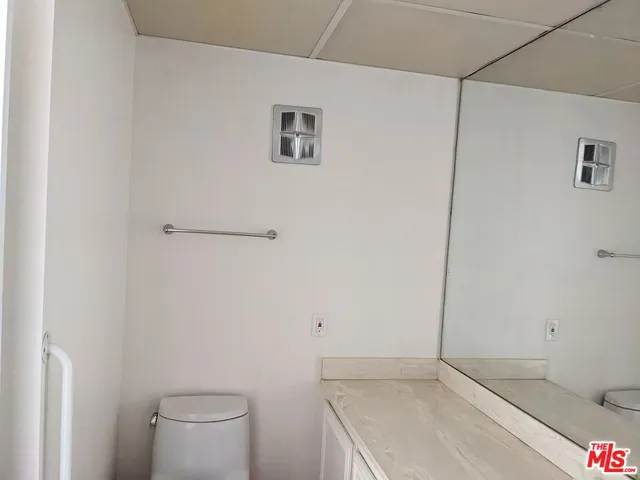 a bathroom with a sink and toilet