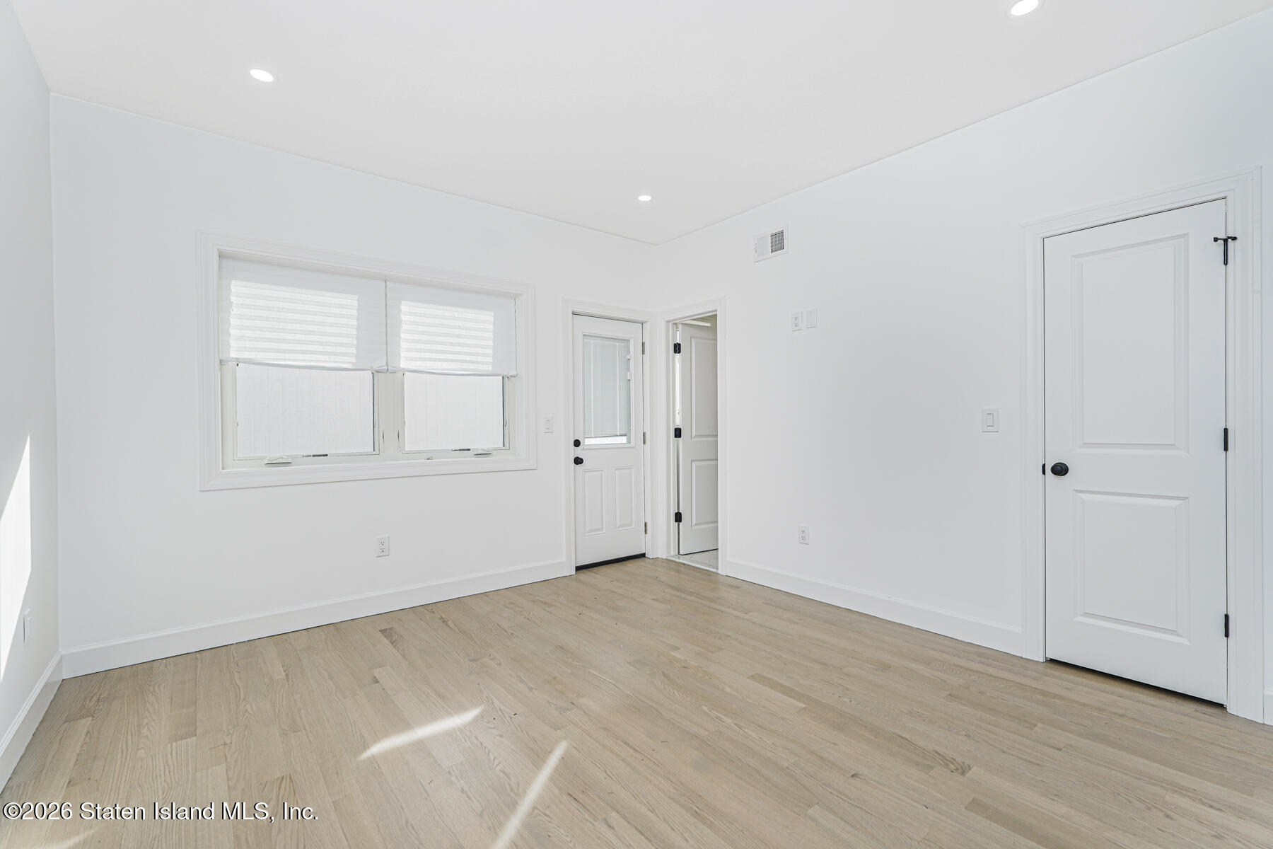 911 Rathbun Avenue Staten Island, NY 10309 - Photo 11 of 30 wooden floor in an empty room