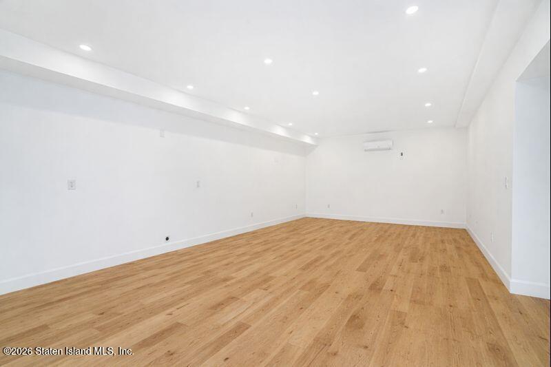 911 Rathbun Avenue Staten Island, NY 10309 - Photo 15 of 30 a view of empty room with wooden floor