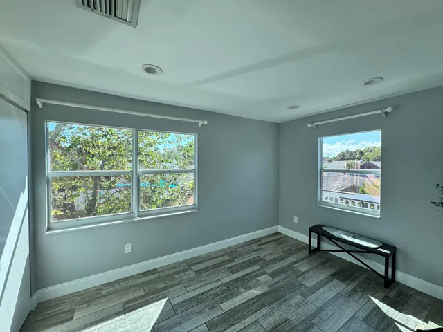 a view of an empty room and window