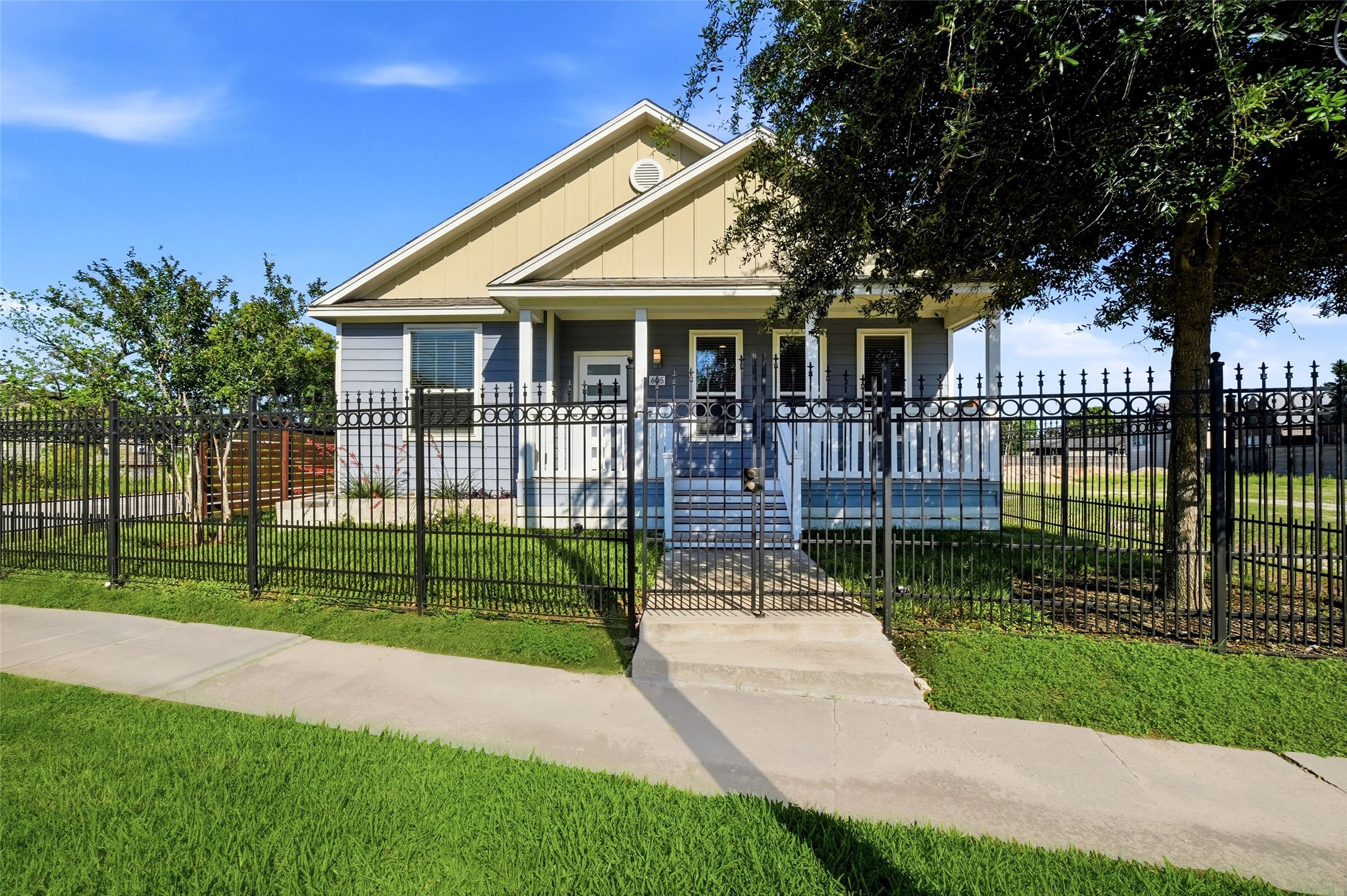 605 Dumble Street Houston, TX 77023 - Photo 2 of 44 a front view of a house with a garden and plants