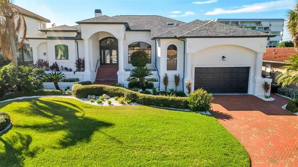 a front view of a house with swimming pool