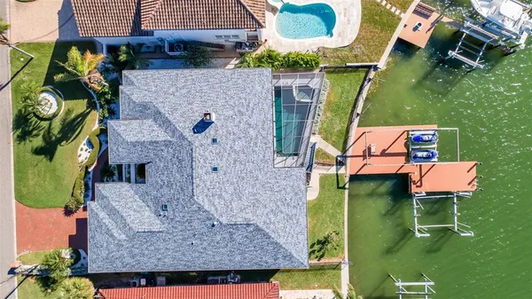 an aerial view of a house with a ocean view