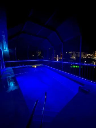 a front view of a house with garden and plants