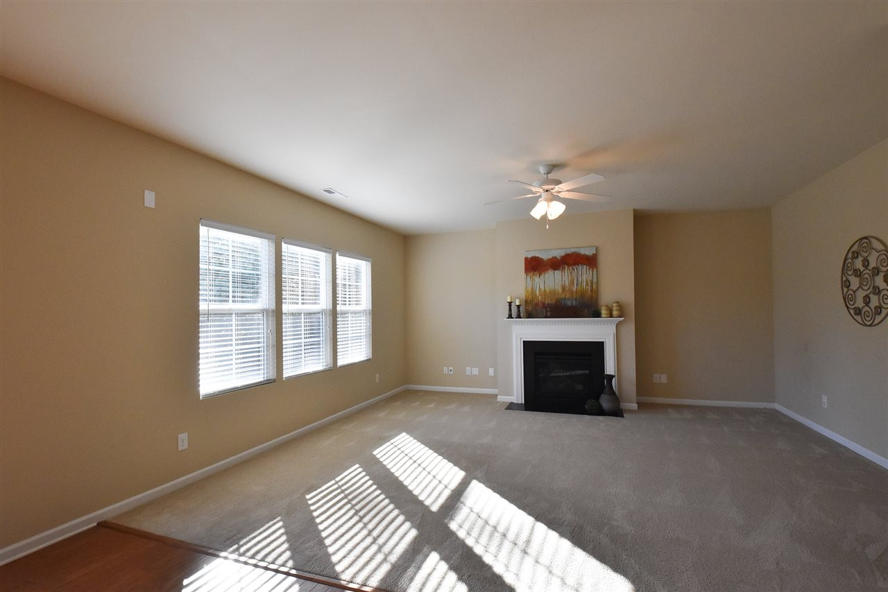 4201 Kellett Lane Raleigh, NC 27616 - Photo 9 of 30 Big Living Rm offers a gas log FP, triple windows, neutral carpet & CF. Living Room