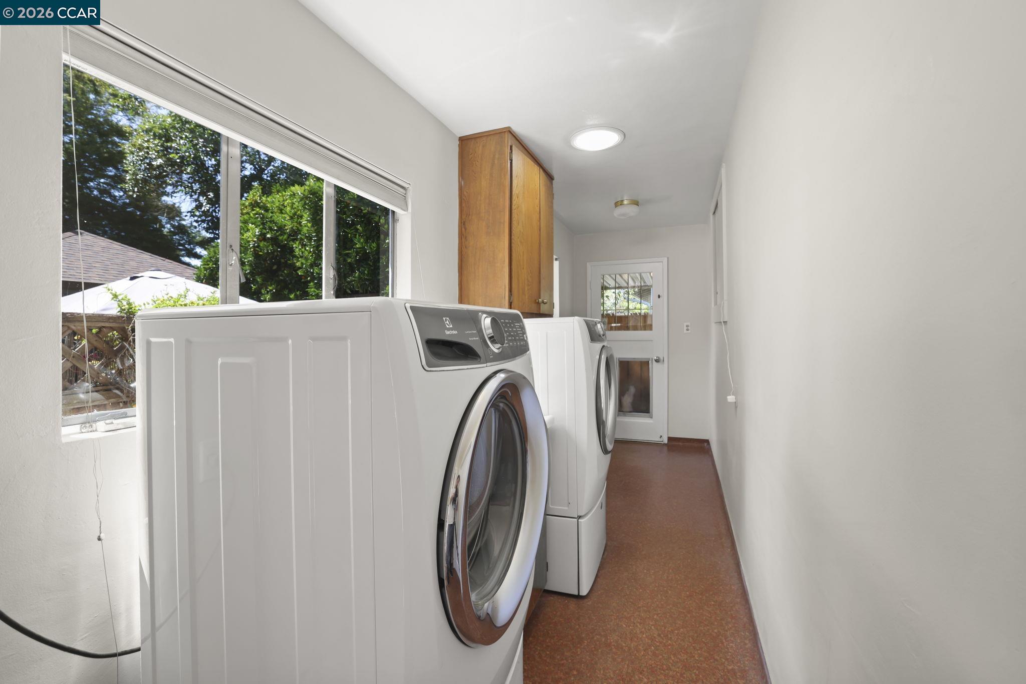 1051 San Rafael Street San Leandro, CA 94577 - Photo 16 of 26 a utility room with a window dryer and washer