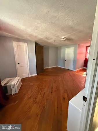a view of a livingroom with wooden floor