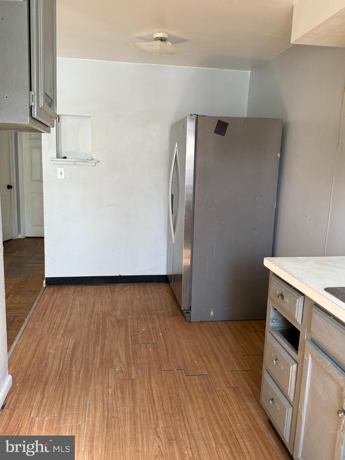 557 Wiltshire Road Upper Darby, PA 19082 - Photo 6 of 27 an empty room with wooden floor and entrance