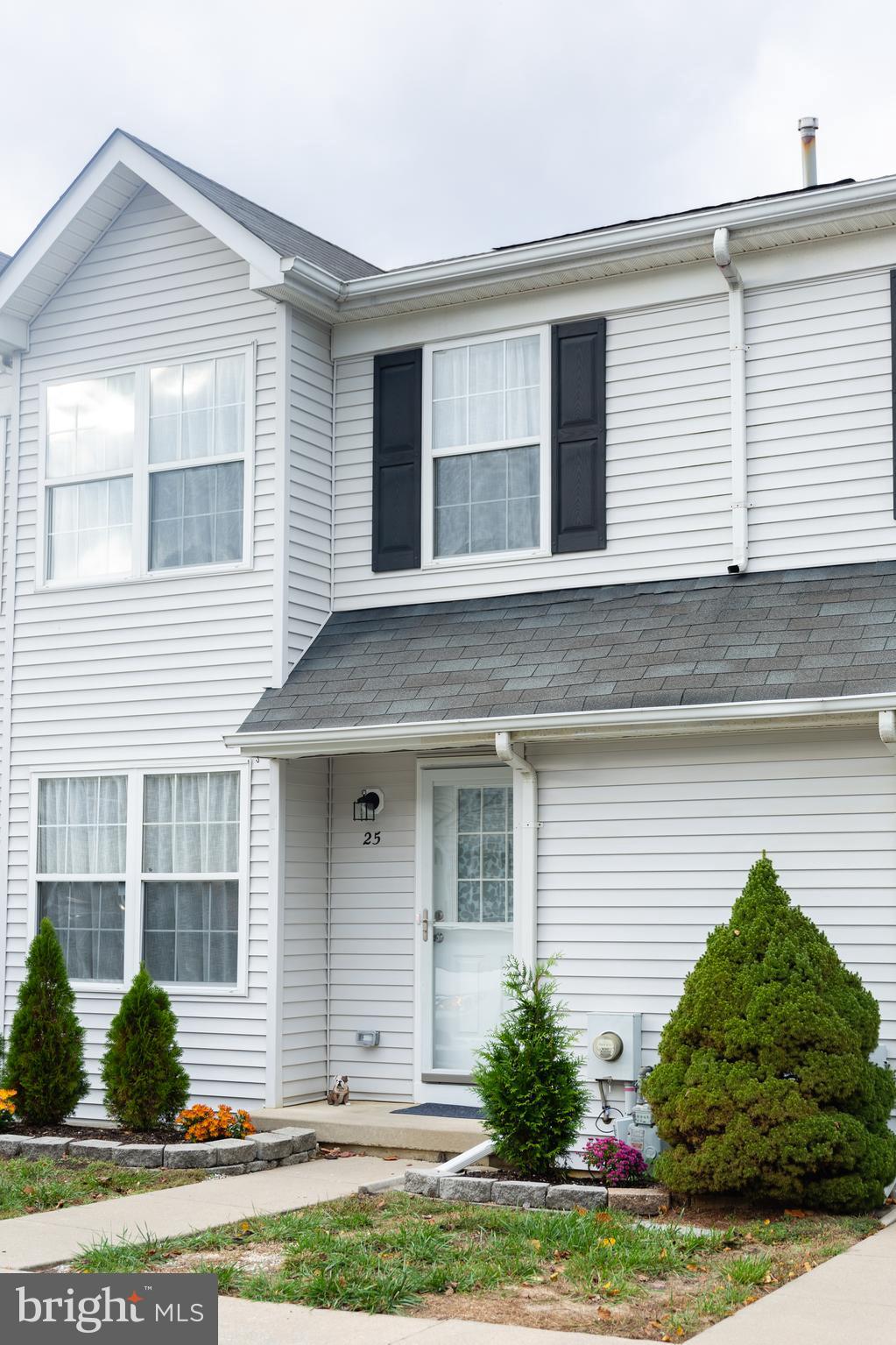 25 Millstream Road Laurel Springs, NJ 08021 - Photo 1 of 31 a front view of a house with a yard and potted plants