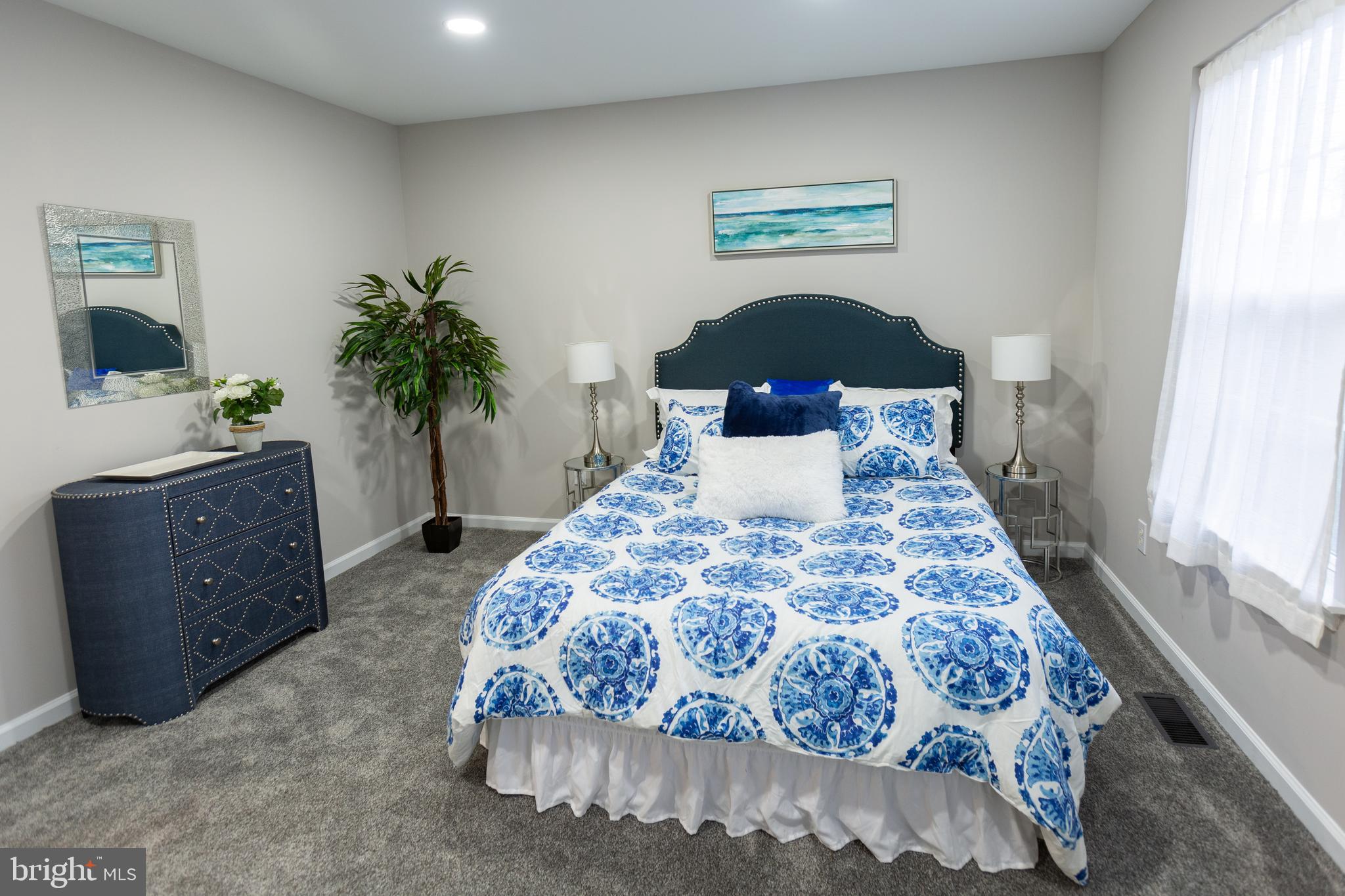 25 Millstream Road Laurel Springs, NJ 08021 - Photo 27 of 31 a bedroom with a bed and a potted plant