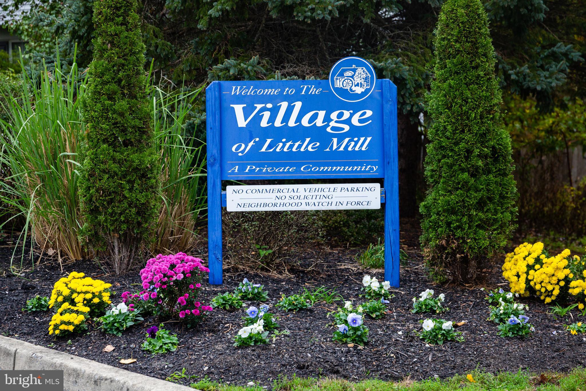 25 Millstream Road Laurel Springs, NJ 08021 - Photo 31 of 31 a sign that is sitting in front of flowers