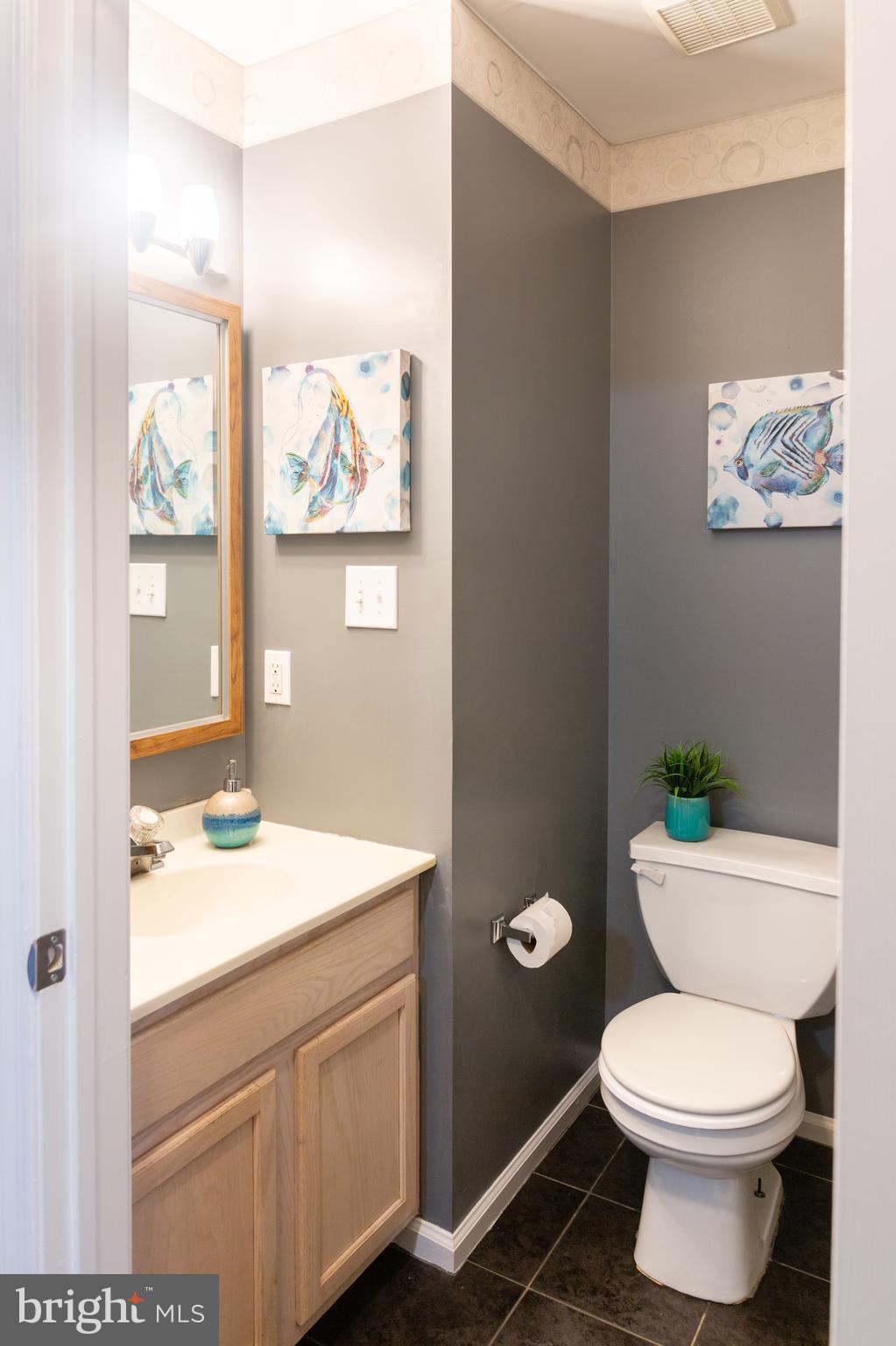 25 Millstream Road Laurel Springs, NJ 08021 - Photo 5 of 31 a bathroom with a sink a toilet and a mirror