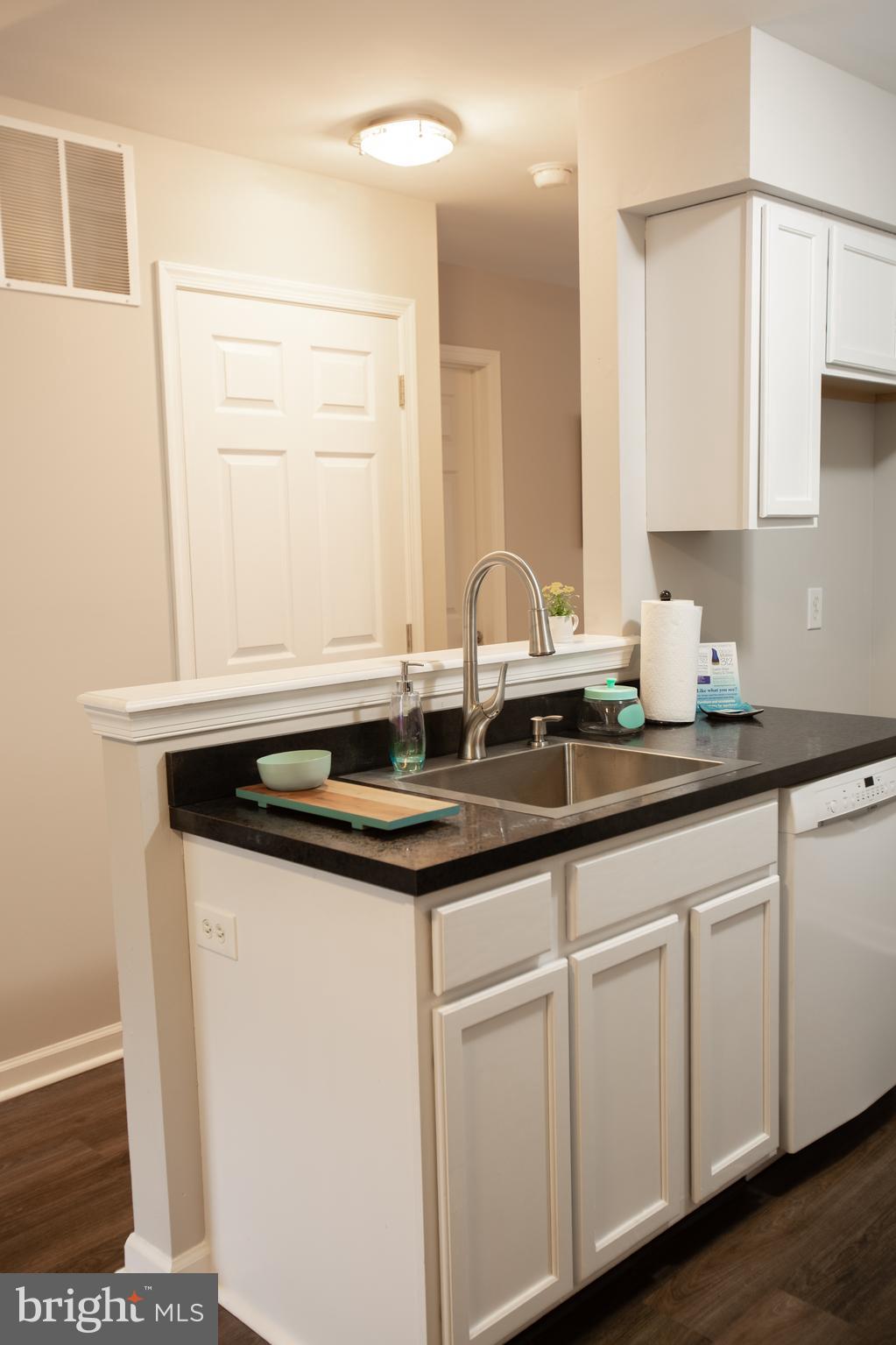 25 Millstream Road Laurel Springs, NJ 08021 - Photo 6 of 31 a kitchen with granite countertop a sink and cabinets