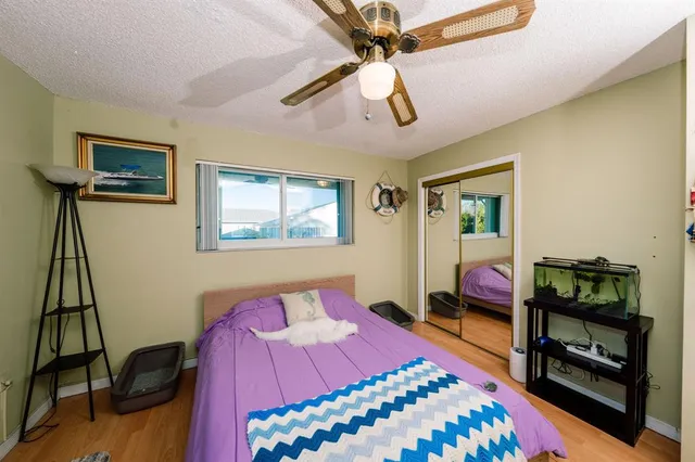 a bedroom with a bed and a bookshelf