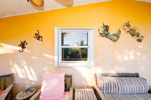 a view of a bedroom with a bed and glass door