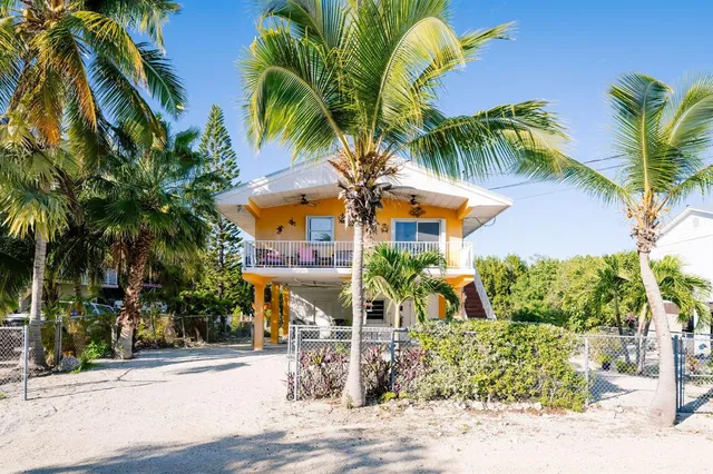 a view of house with swimming pool