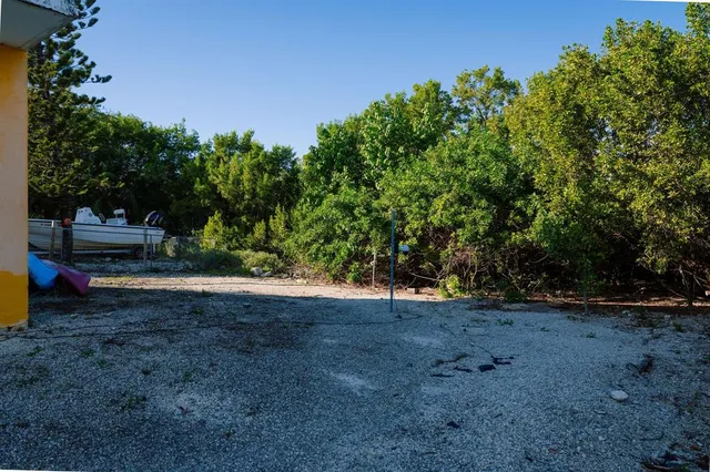 a view of a lake with houses in the back
