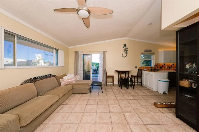 a living room with fireplace furniture and a flat screen tv