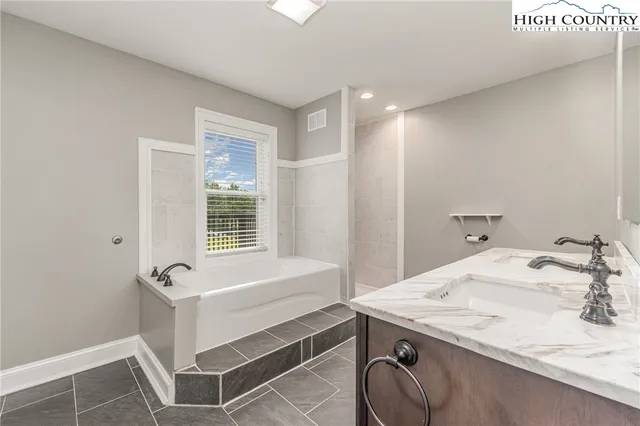 a bathroom with a toilet a sink and a bathtub