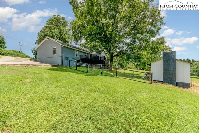 a view of a house with a big yard