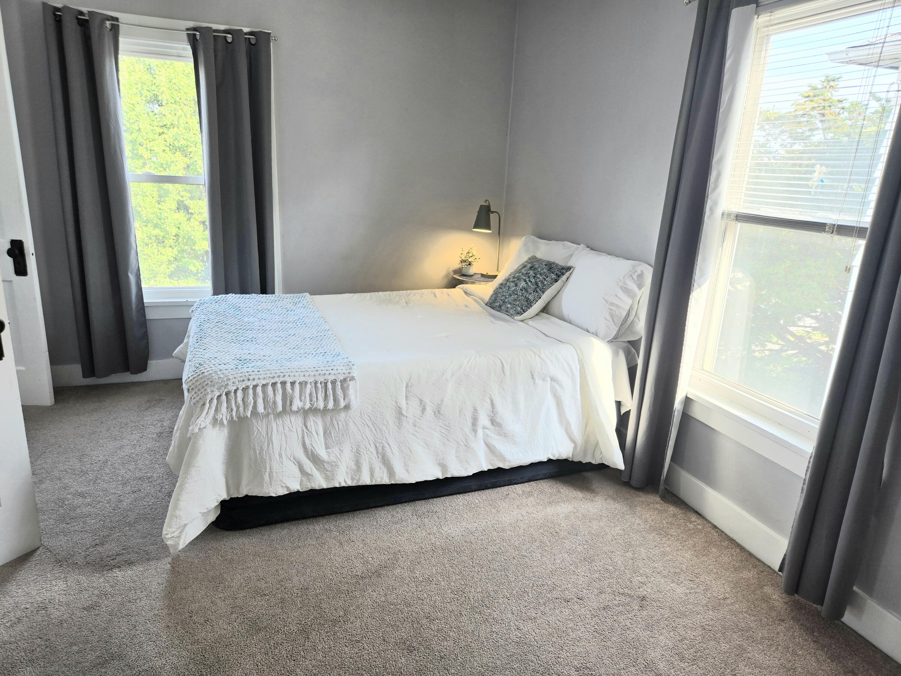 1012 177th Place Hammond, IN 46324 - Photo 11 of 26 a bed sitting in a bedroom next to a window