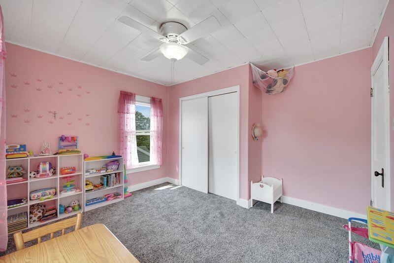 1012 177th Place Hammond, IN 46324 - Photo 13 of 26 wooden floor with white walls and chandelier