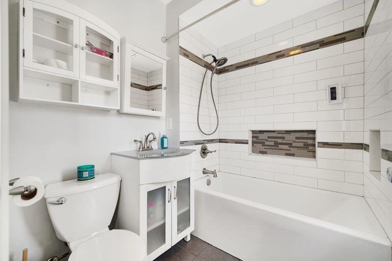 1012 177th Place Hammond, IN 46324 - Photo 14 of 26 a bathroom with a sink and a bathtub