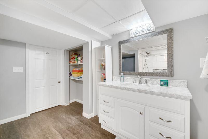 1012 177th Place Hammond, IN 46324 - Photo 20 of 26 a en suite bathroom with a double vanity sink and a mirror