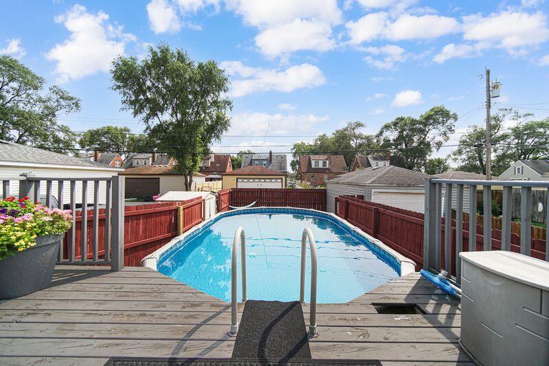 1012 177th Place Hammond, IN 46324 - Photo 23 of 26 a view of a balcony with wooden floor and potted plants