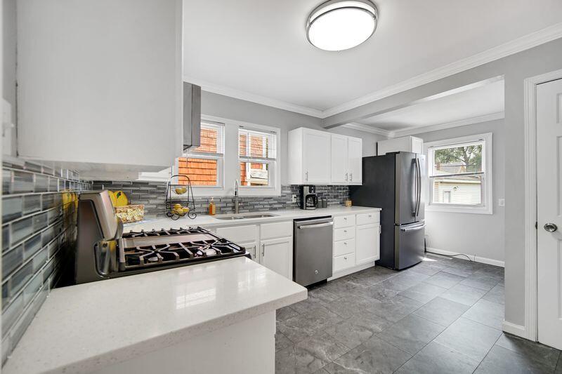 1012 177th Place Hammond, IN 46324 - Photo 6 of 26 a kitchen with a refrigerator and a stove top oven