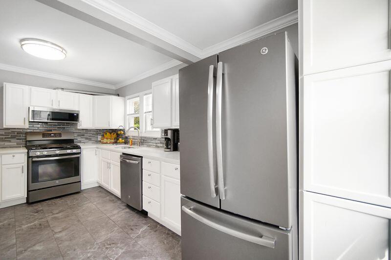 1012 177th Place Hammond, IN 46324 - Photo 8 of 26 a kitchen with a refrigerator stove and microwave