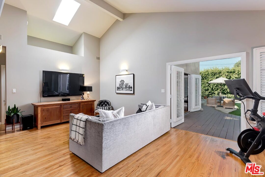 10629 Rountree Road Los Angeles, CA 90064 - Photo 16 of 37 a living room with furniture and a flat screen tv