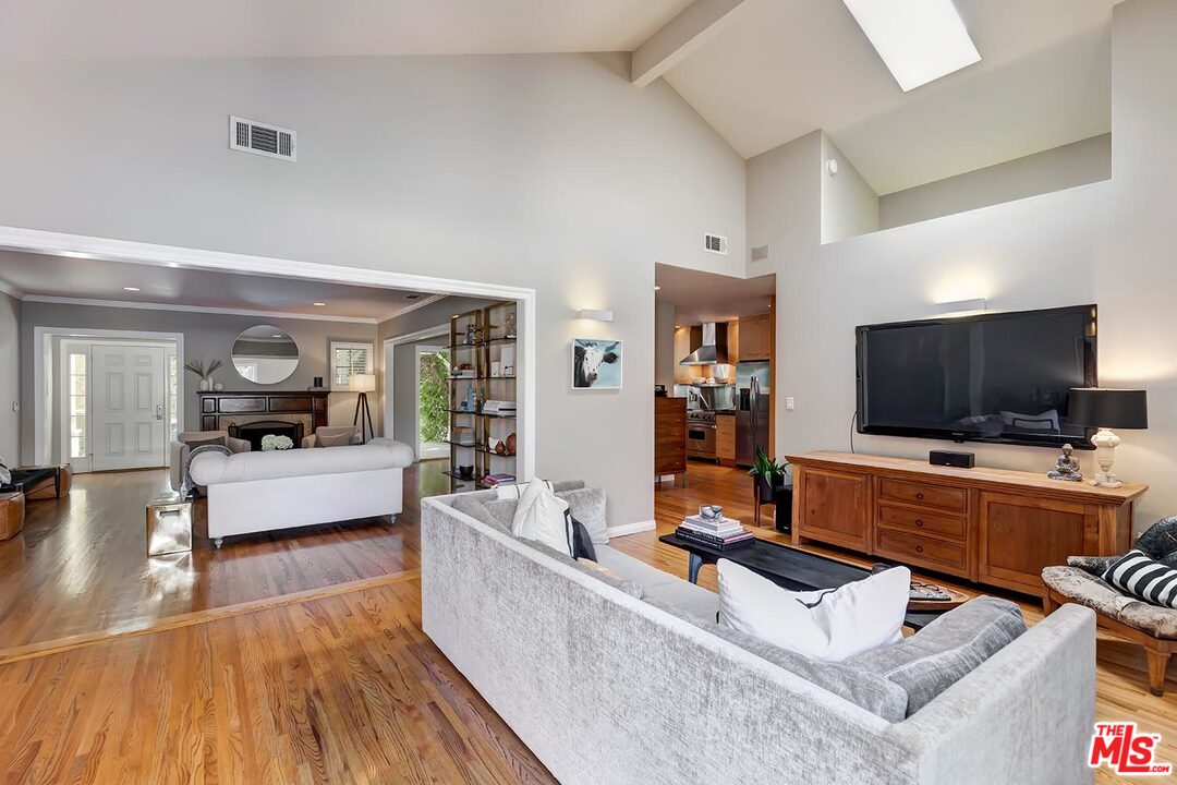 10629 Rountree Road Los Angeles, CA 90064 - Photo 18 of 37 a living room with furniture and a flat screen tv