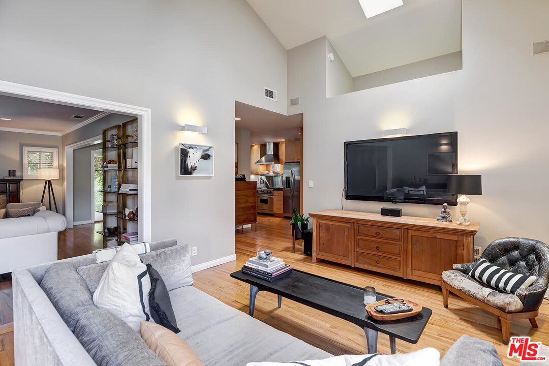 10629 Rountree Road Los Angeles, CA 90064 - Photo 19 of 37 a living room with furniture and a flat screen tv