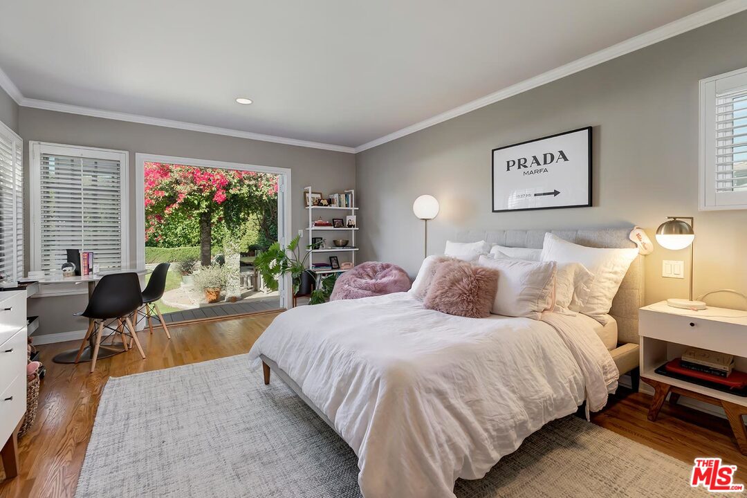 10629 Rountree Road Los Angeles, CA 90064 - Photo 26 of 37 a spacious bedroom with a bed and a large window