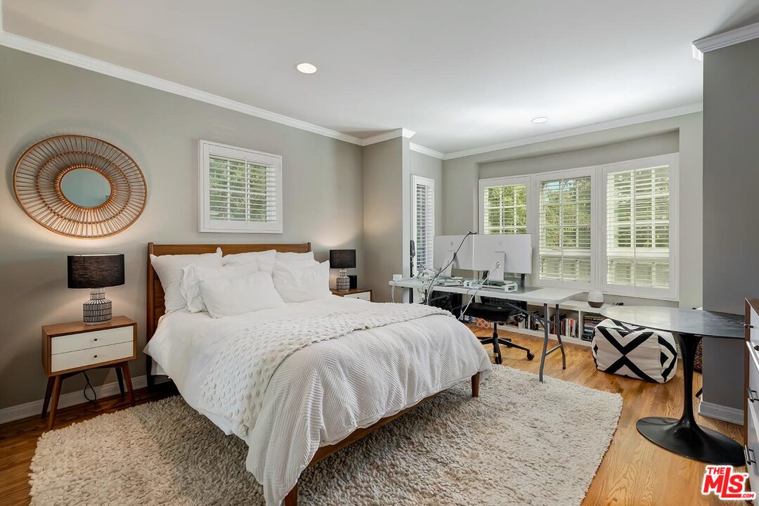 10629 Rountree Road Los Angeles, CA 90064 - Photo 29 of 37 a bedroom with a bed and a table with chair