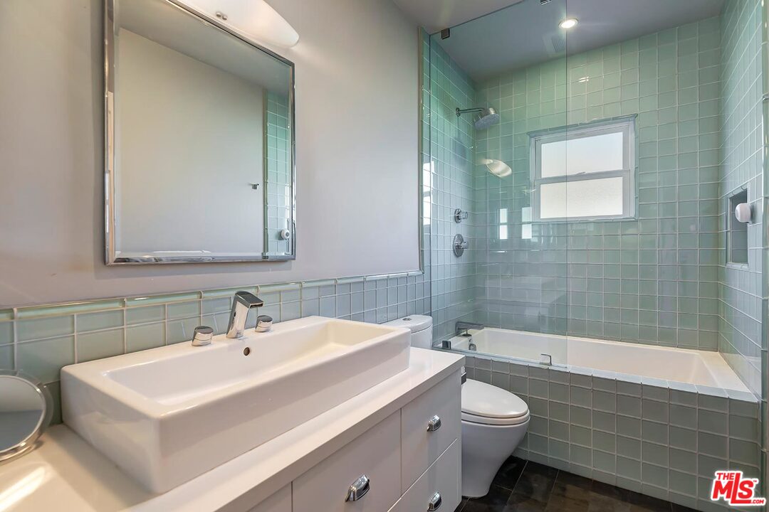10629 Rountree Road Los Angeles, CA 90064 - Photo 30 of 37 a bathroom with a sink toilet and shower