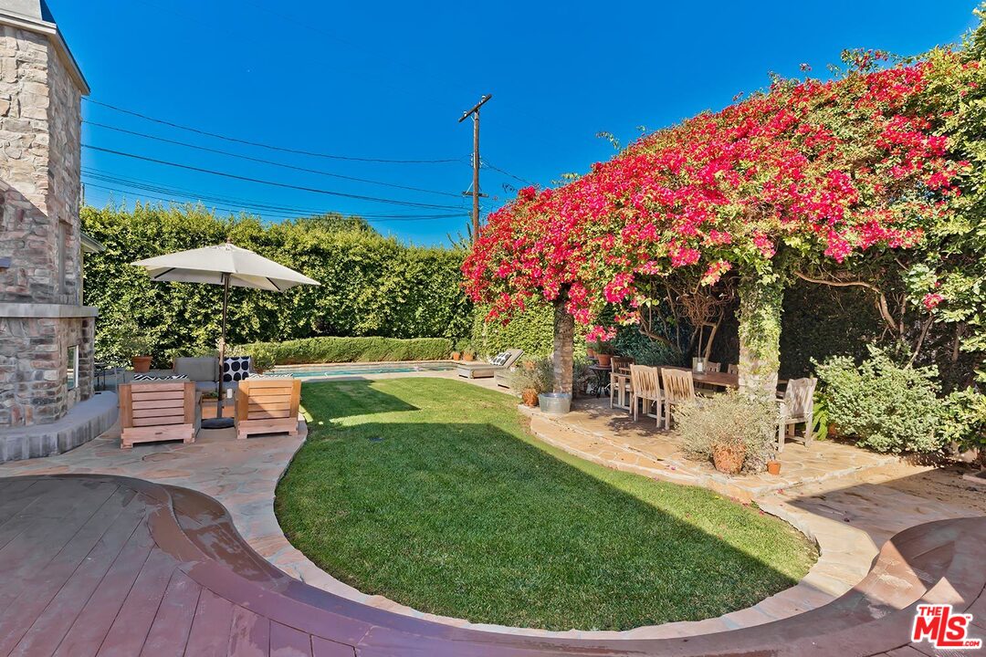 10629 Rountree Road Los Angeles, CA 90064 - Photo 32 of 37 a view of a swimming pool with a patio