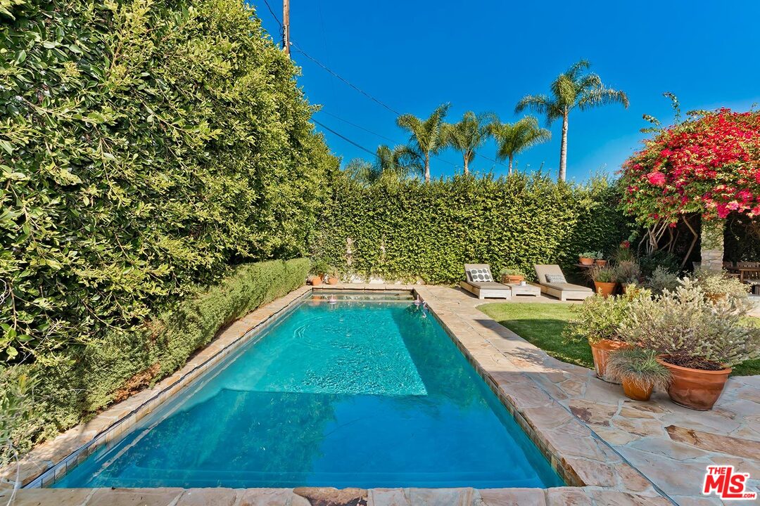 10629 Rountree Road Los Angeles, CA 90064 - Photo 35 of 37 a view of a swimming pool with a yard