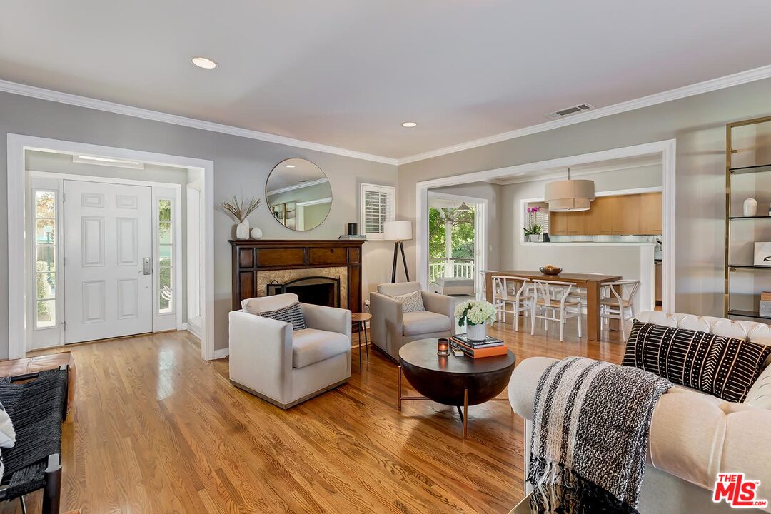 10629 Rountree Road Los Angeles, CA 90064 - Photo 5 of 37 a living room with furniture fireplace and a large window