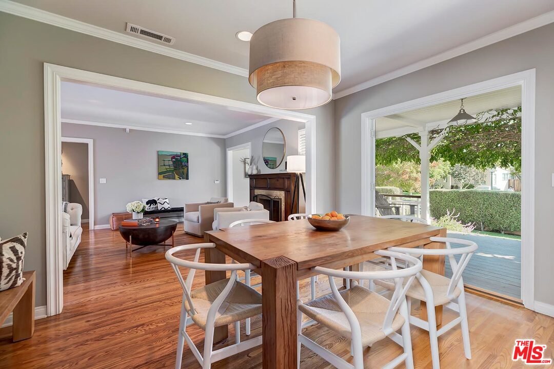 10629 Rountree Road Los Angeles, CA 90064 - Photo 10 of 37 a view of a dining room with furniture window and wooden floor