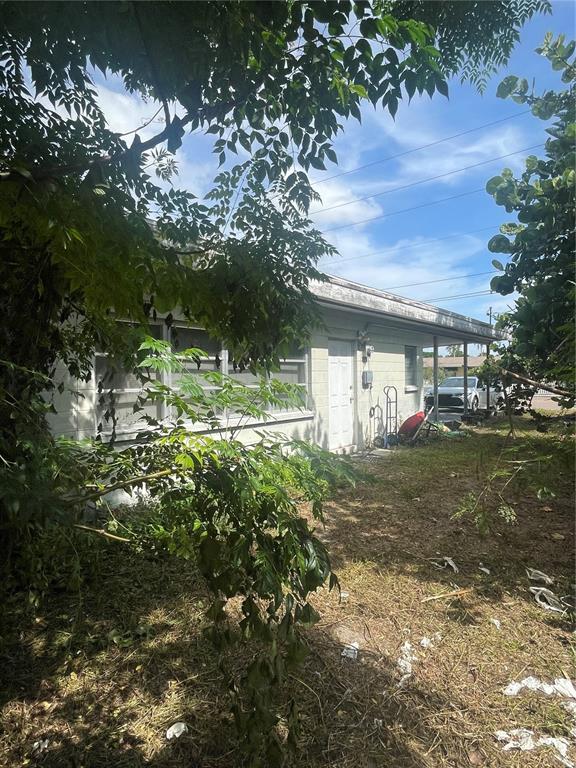 2445 Webber Street Sarasota, FL 34239 - Photo 8 of 16 a view of a house with a yard