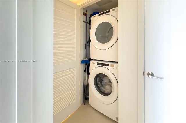 a bedroom with a bed and painting on the wall