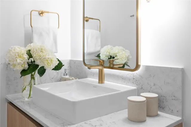 a view of a chairs and table in the balcony