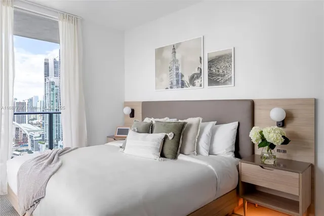 a kitchen with stainless steel appliances granite countertop a sink and a large window