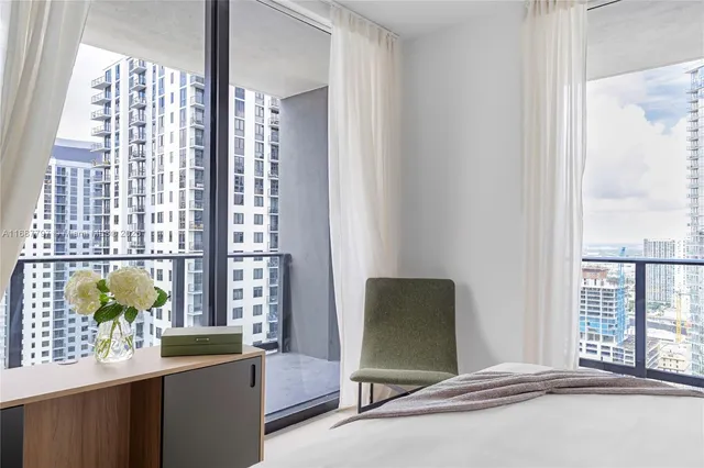 a view of a swimming pool and an outdoor seating